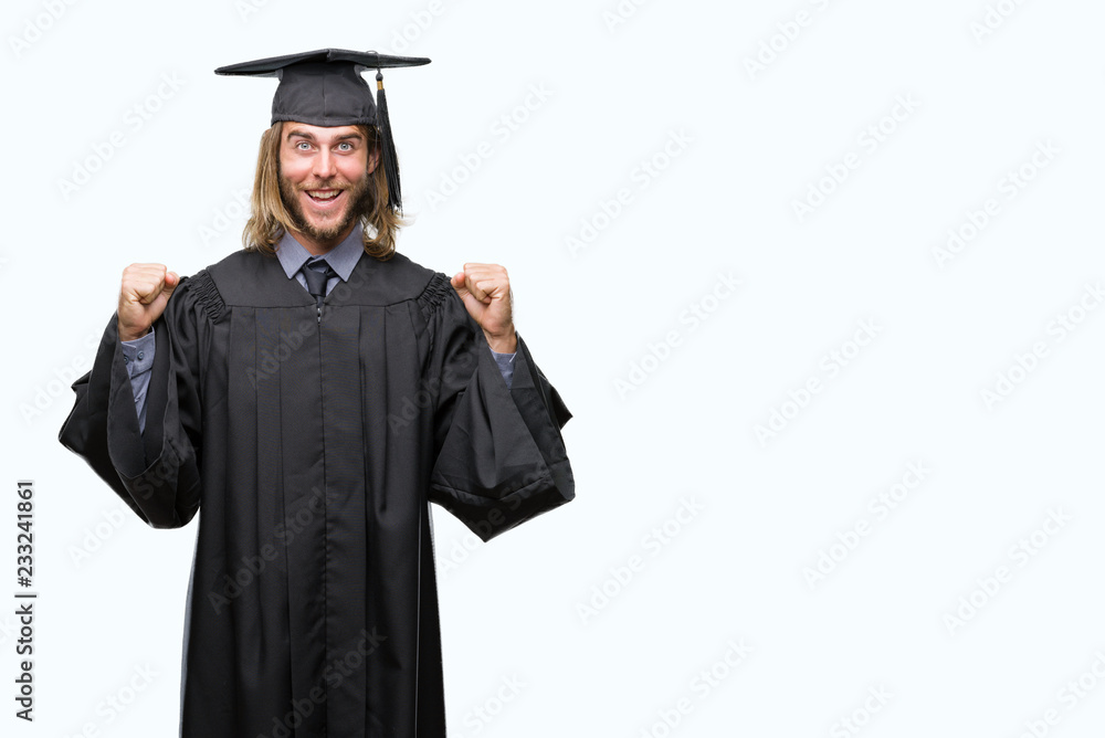 Young handsome graduated man with long hair over isolated background celebrating surprised and amazed for success with arms raised and open eyes. Winner concept. Young handsome graduated man with long hair over isolated background celebrating surprised and amazed for success with arms raised and open eyes. Winner concept.