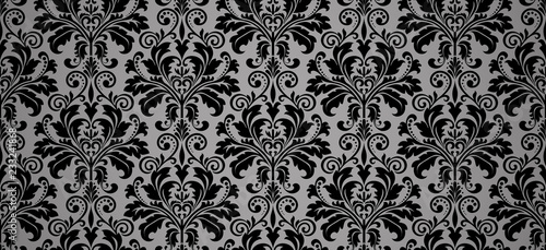 Wallpaper in the style of Baroque. Seamless vector background. Black and grey floral ornament. Graphic pattern for fabric, wallpaper, packaging. Ornate Damask flower ornament