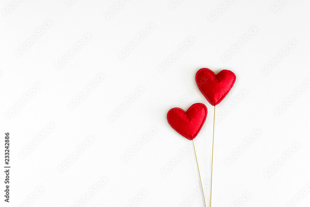 Felt love hearts on booth props on white wooden background. Valentine's day celebration concept. Top view. Flat lay. Copy space