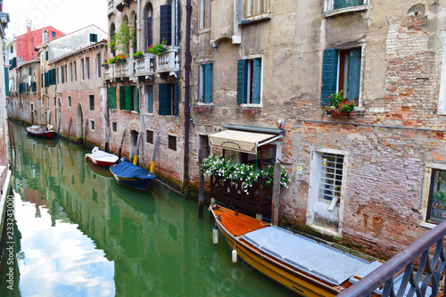 A Narrow Canal Next to Quaint Buildings in Venice