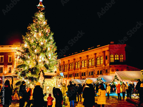 People and Christmas tree market in Riga Dome square
