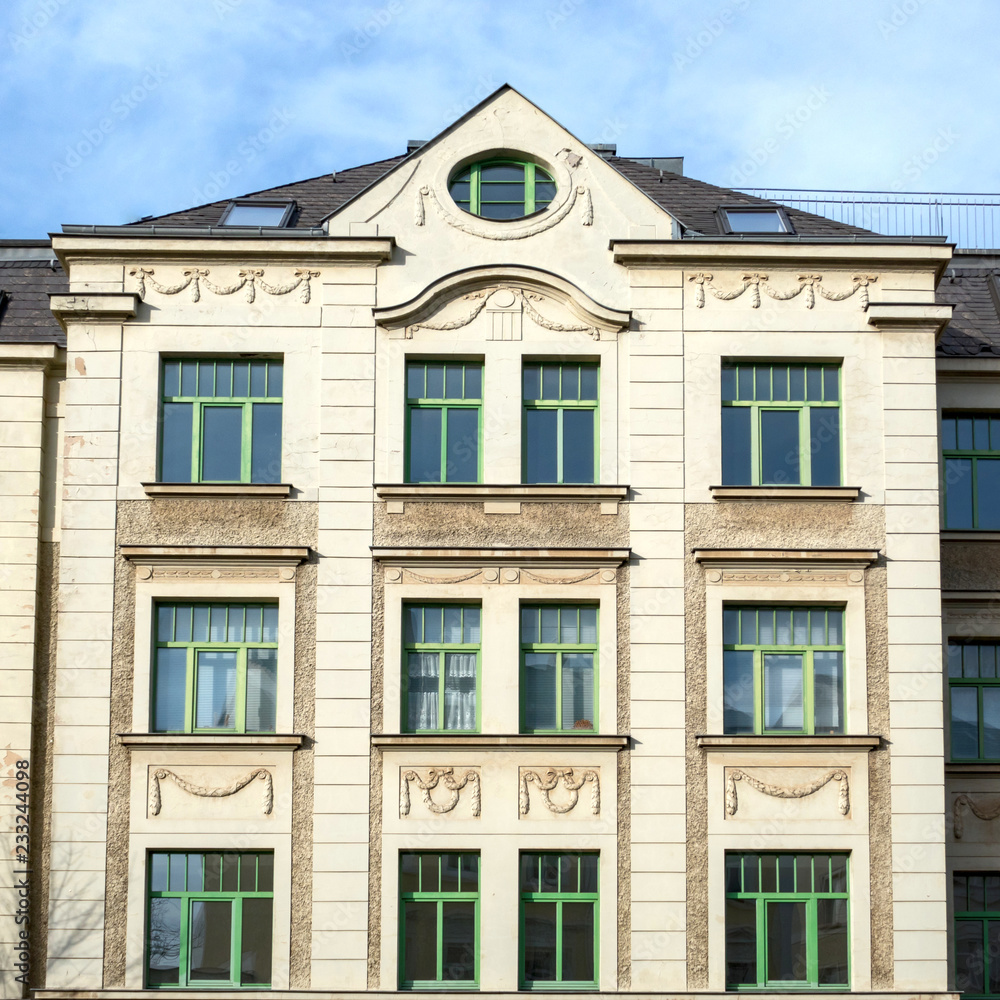 renovated vintage house main facade with decorated windows pattern, Gera city in Thuringen, Germany