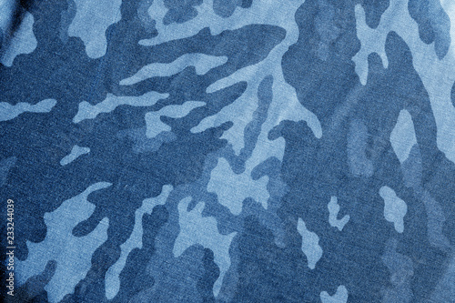 Old camouflage cloth with blur effect in navy blue tone.