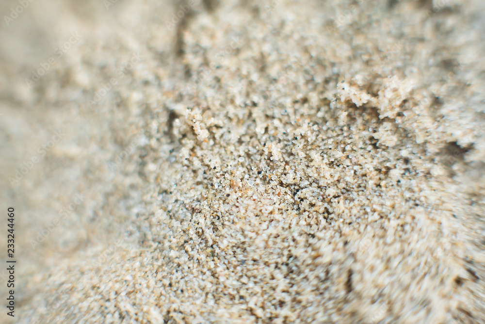 Macro wet sand on the beach in summer. Background. Defocused Macro wet sand on the beach in summer. Background. Defocused