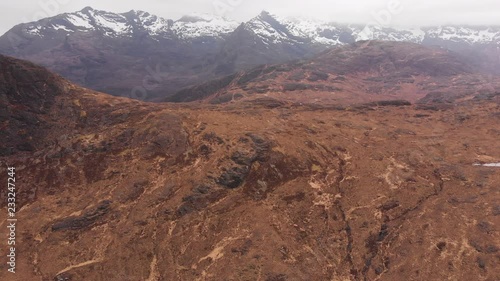 Aerial drone shot of Sgurr Alasdair mountain and Black Cuillin ridge on Isle of Skye, Scotland photo