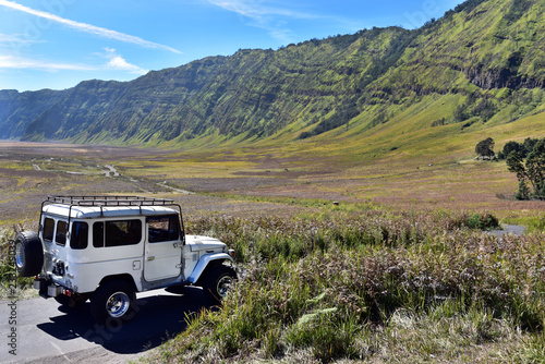 Adventurous jeep tour around the Mount Bromo in sunny day, Java Island, Indonesia