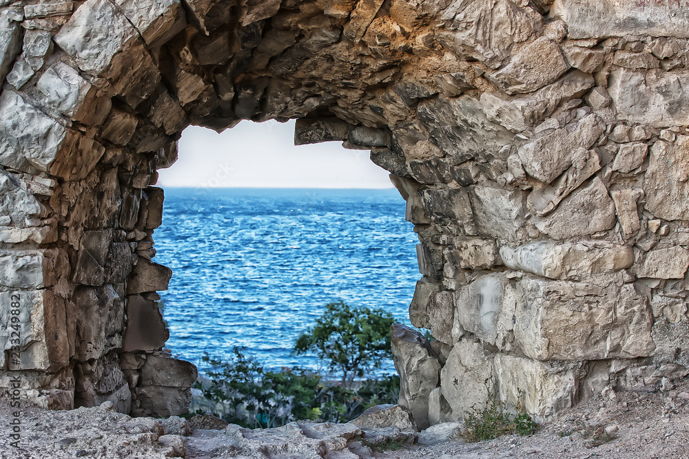 view of the sea through the loophole of the fortress view of the sea through the loophole of the fortress