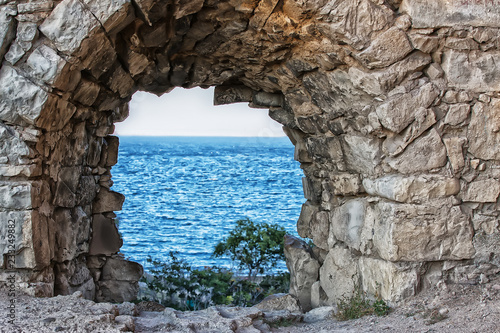 view of the sea through the loophole of the fortress