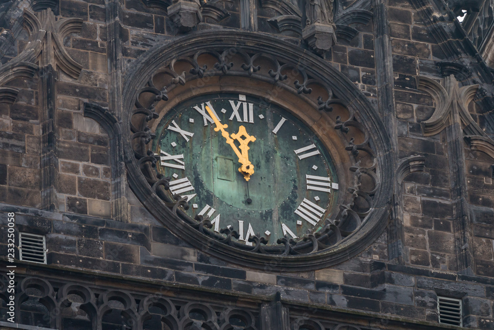 Tower clock five minutes to twelve Tower clock five minutes to twelve