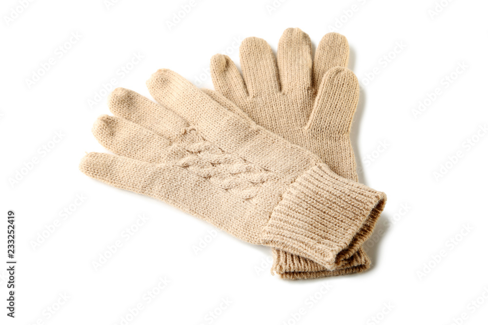 Knitted beige gloves isolated on white background Knitted beige gloves isolated on white background