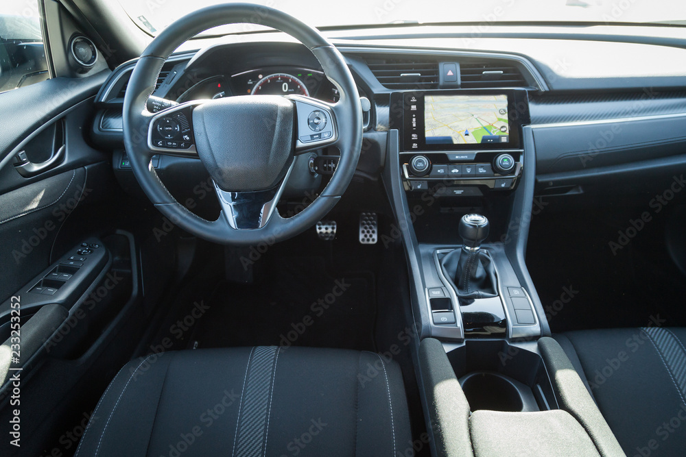 Modern car interior with steering wheel