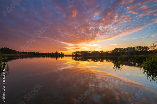 fiery sky ,beautiful sunset over an autumn lake © Mike Mareen