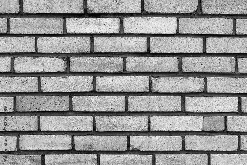 The old rectangular grey brick wall texture background. The old rectangular grey brick wall texture background.