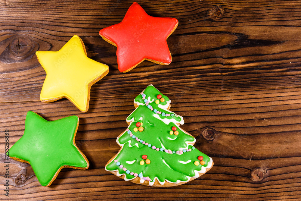 Gingerbread christmas trees and stars on wooden table. Top view Gingerbread christmas trees and stars on wooden table. Top view