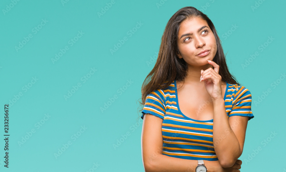 Young beautiful arab woman over isolated background with hand on chin thinking about question, pensive expression. Smiling with thoughtful face. Doubt concept. Young beautiful arab woman over isolated background with hand on chin thinking about question, pensive expression. Smiling with thoughtful face. Doubt concept.