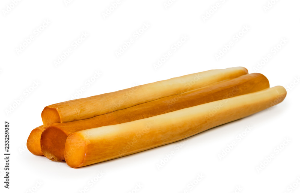 Sticks of smoked cheese closeup on a white. Isolated. Sticks of smoked cheese closeup on a white. Isolated.