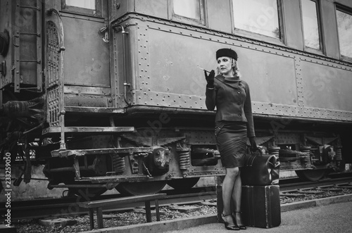 Retro woman on the train station