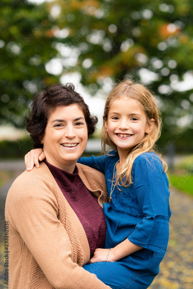 Mother and daughter posing outdoors Mother and daughter posing outdoors