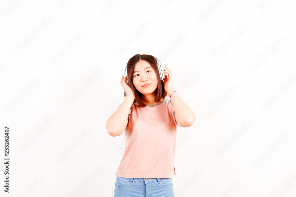 Portrait of beautiful asian young woman with brunette hair and bob hairstyle, fashionable hipster outfit alone in bright lighted room. Background, copy space for text, close up. Portrait of beautiful asian young woman with brunette hair and bob hairstyle, fashionable hipster outfit alone in bright lighted room. Background, copy space for text, close up.