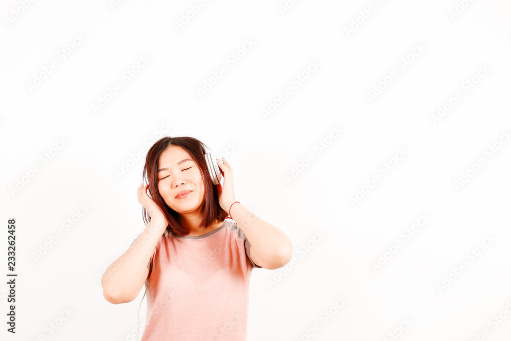 Portrait of beautiful asian young woman with brunette hair and bob hairstyle, fashionable hipster outfit alone in bright lighted room. Background, copy space for text, close up. Portrait of beautiful asian young woman with brunette hair and bob hairstyle, fashionable hipster outfit alone in bright lighted room. Background, copy space for text, close up.