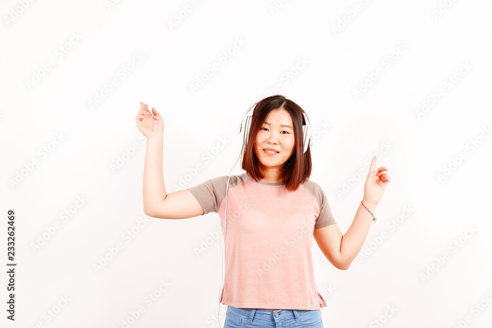 Portrait of beautiful asian young woman with brunette hair and bob hairstyle, fashionable hipster outfit alone in bright lighted room. Background, copy space for text, close up. Portrait of beautiful asian young woman with brunette hair and bob hairstyle, fashionable hipster outfit alone in bright lighted room. Background, copy space for text, close up.