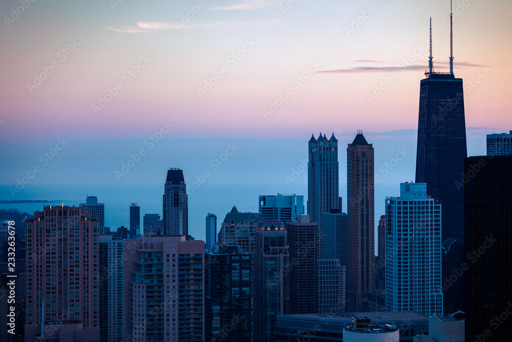 Aerial view of downtown Chicago as the early morning light washes over the tall skyscrapers