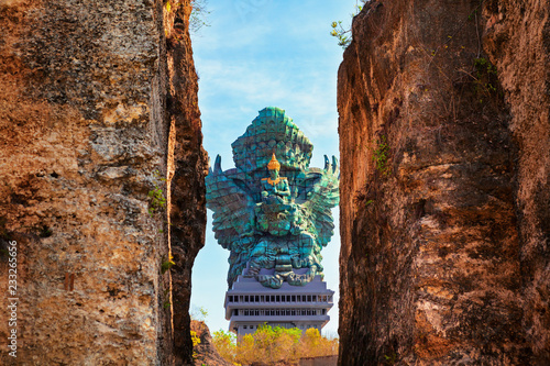 Landscape picture of Garuda Wisnu Kencana GWK statue as Bali landmark with blue sky as a background. Balinese traditional symbol of hindu religion. Popular travel destinations in Indonesia.