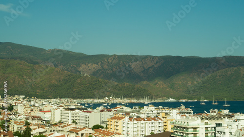 Mountain town panoramic view. city between the hills © maxkolmeto