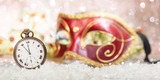 Carnival party. Minutes to midnight on an old watch, venetian mask, bokeh festive background, banner