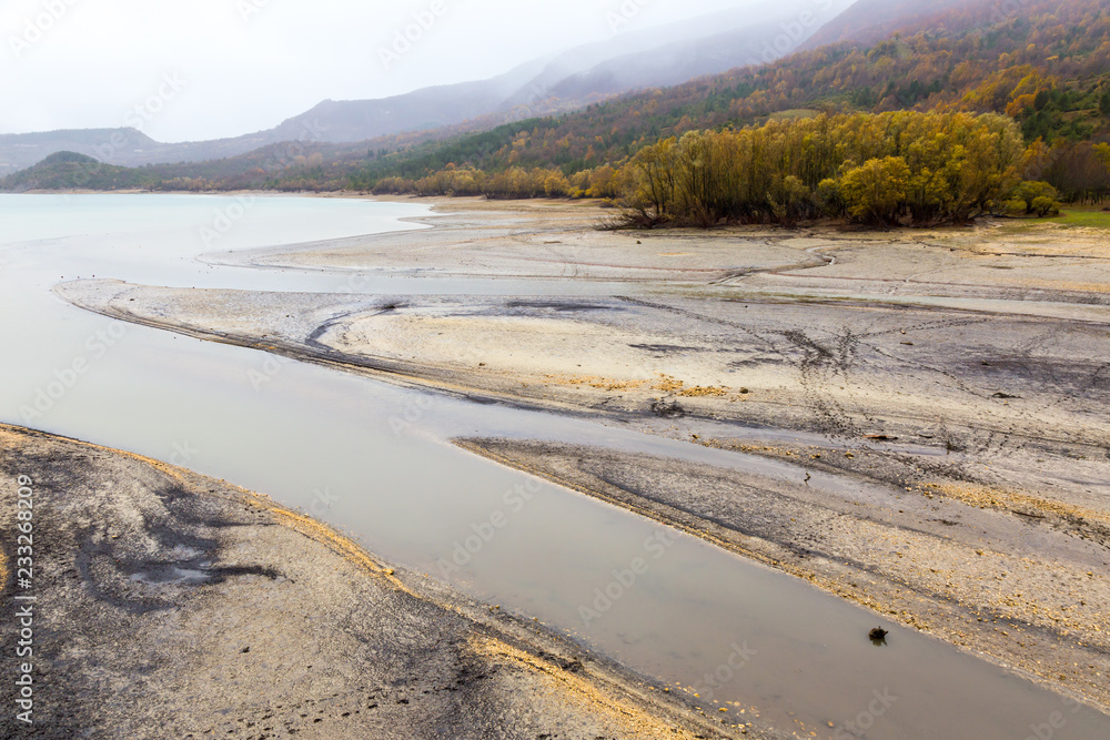 View of Barrea Lake almost dry, Lake Barrea, Abruzzo, Italy. October 13, 2017 View of Barrea Lake almost dry, Lake Barrea, Abruzzo, Italy. October 13, 2017