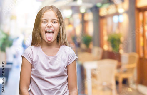 Young beautiful girl over isolated background sticking tongue out happy with funny expression. Emotion concept. Free Download Young beautiful girl over isolated background sticking tongue out happy with funny expression. Emotion concept. - GFXLoad