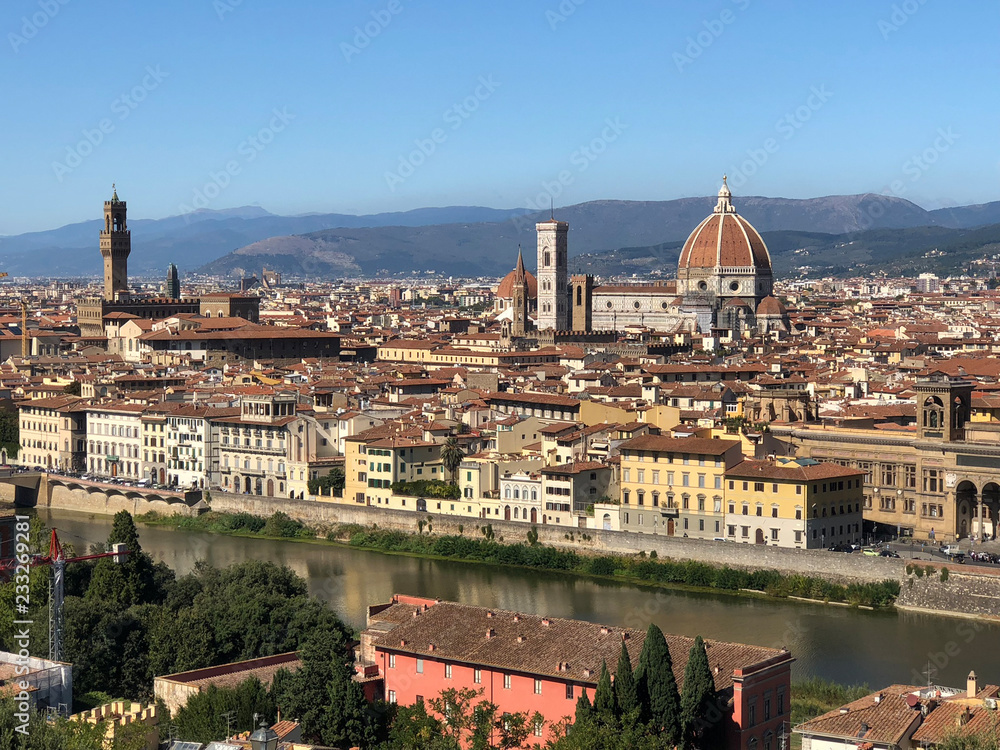Obraz premium Aerial view of the tower of Palazzo Vecchio or Palazzo della Signoria (The Old Palace), Florence Cathedral and Duomo tower from Michelangelo Square.