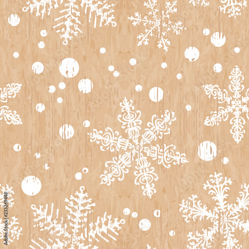 Gift paper. Winter patterns on a beige background. Faded snowflakes. Seamless christmas texture. Eps 10 vector.