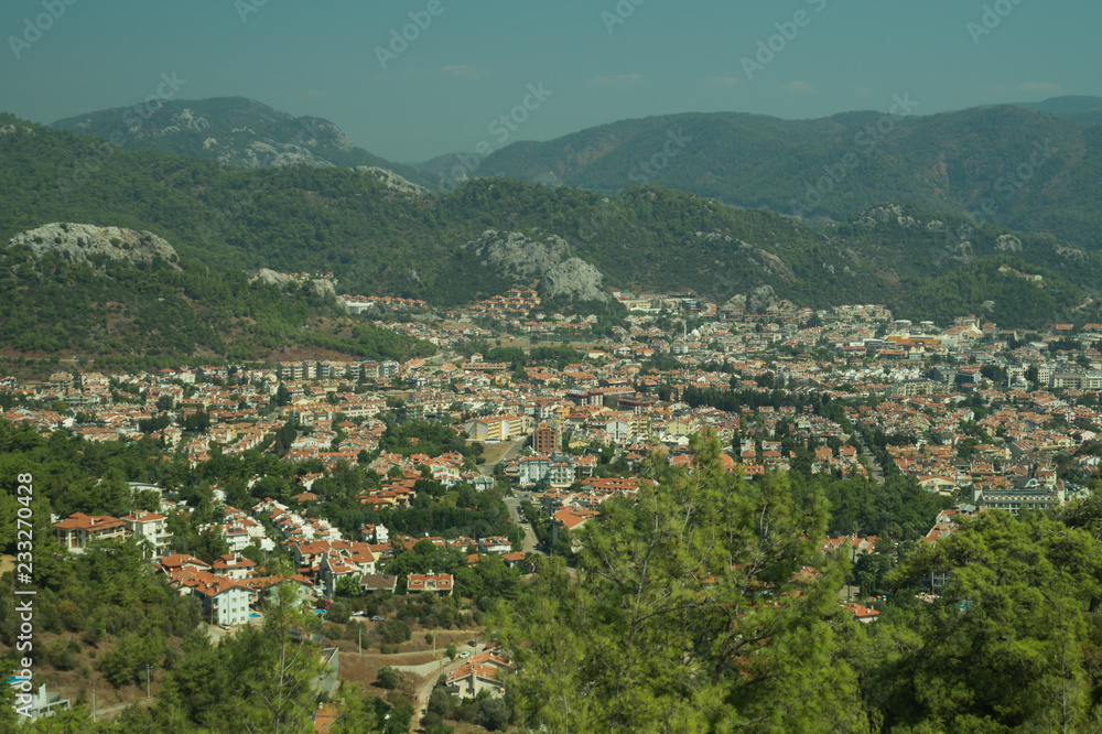 Mountain town panoramic view. city between the hills Mountain town panoramic view. city between the hills