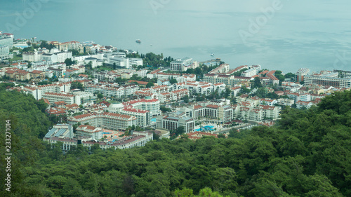 Mountain town panoramic view. city between the hills with the sea