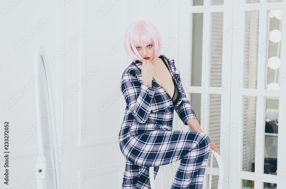 young sensual woman in sexy pajama posing near mirror young sensual woman in sexy pajama posing near mirror