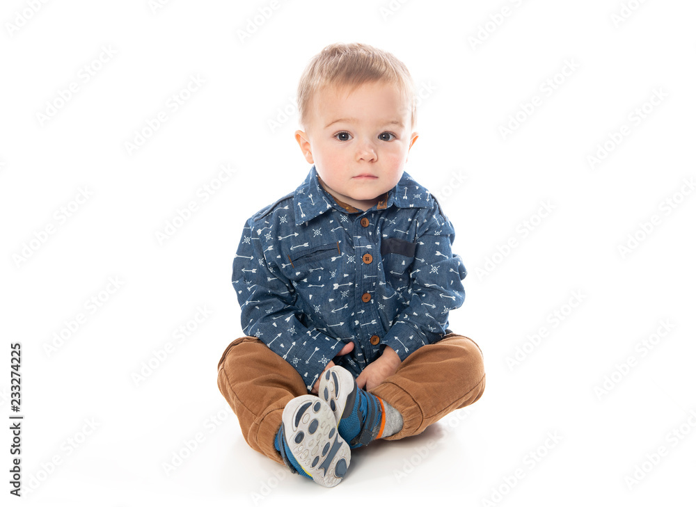 A Cute Little Boy Isolated on the White Background. A Cute Little Boy Isolated on the White Background.