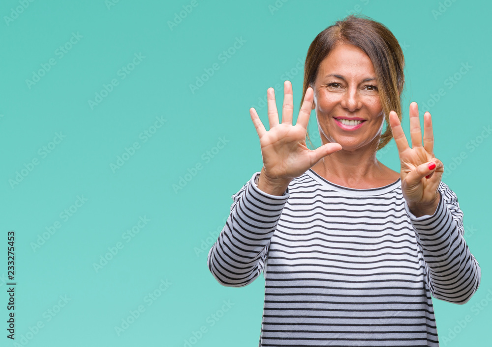 Middle age senior hispanic woman over isolated background showing and pointing up with fingers number eight while smiling confident and happy. Middle age senior hispanic woman over isolated background showing and pointing up with fingers number eight while smiling confident and happy.