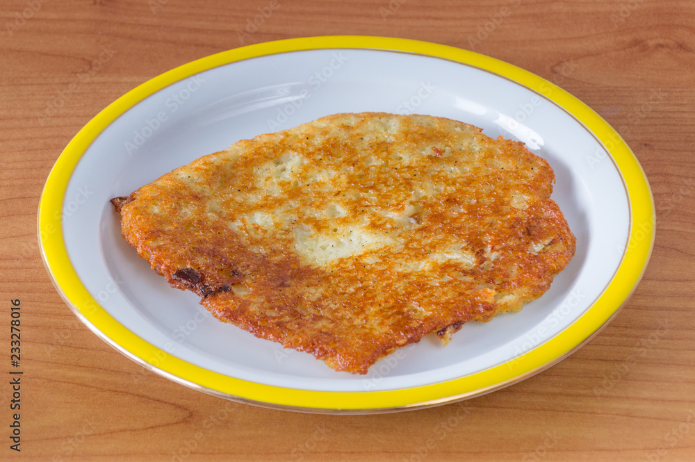 Polish placki ziemniaczane. Potato pancakes, latkes, deruny or boxties Polish placki ziemniaczane. Potato pancakes, latkes, deruny or boxties