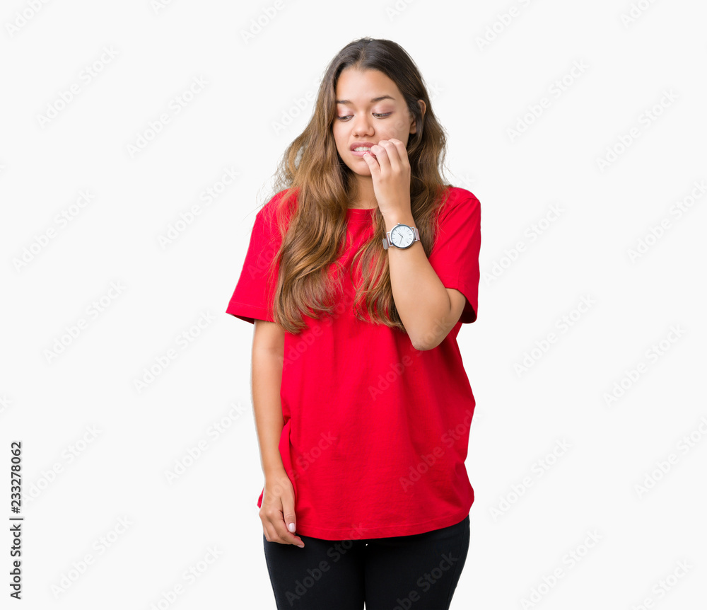 Young beautiful brunette woman wearing red t-shirt over isolated background looking stressed and nervous with hands on mouth biting nails. Anxiety problem. Young beautiful brunette woman wearing red t-shirt over isolated background looking stressed and nervous with hands on mouth biting nails. Anxiety problem.