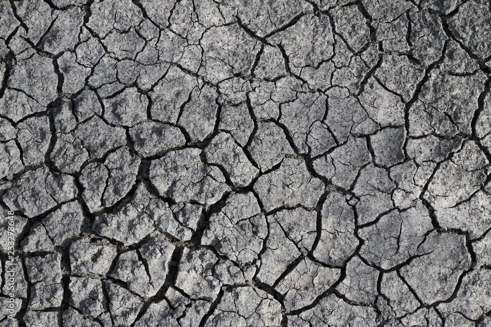 Close up of cracks in the dry desert sand Close up of cracks in the dry desert sand