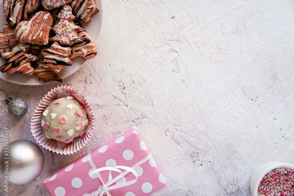 Top view of delicious sweets and Christmas decoration, against white textured background. Top view of delicious sweets and Christmas decoration, against white textured background.