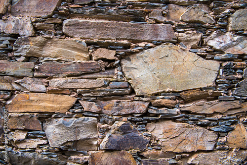 Close-up detail view of an old traditional stone wall built from schist in Cerdeira, one of Portugal's schist villages in the Aldeias do Xisto