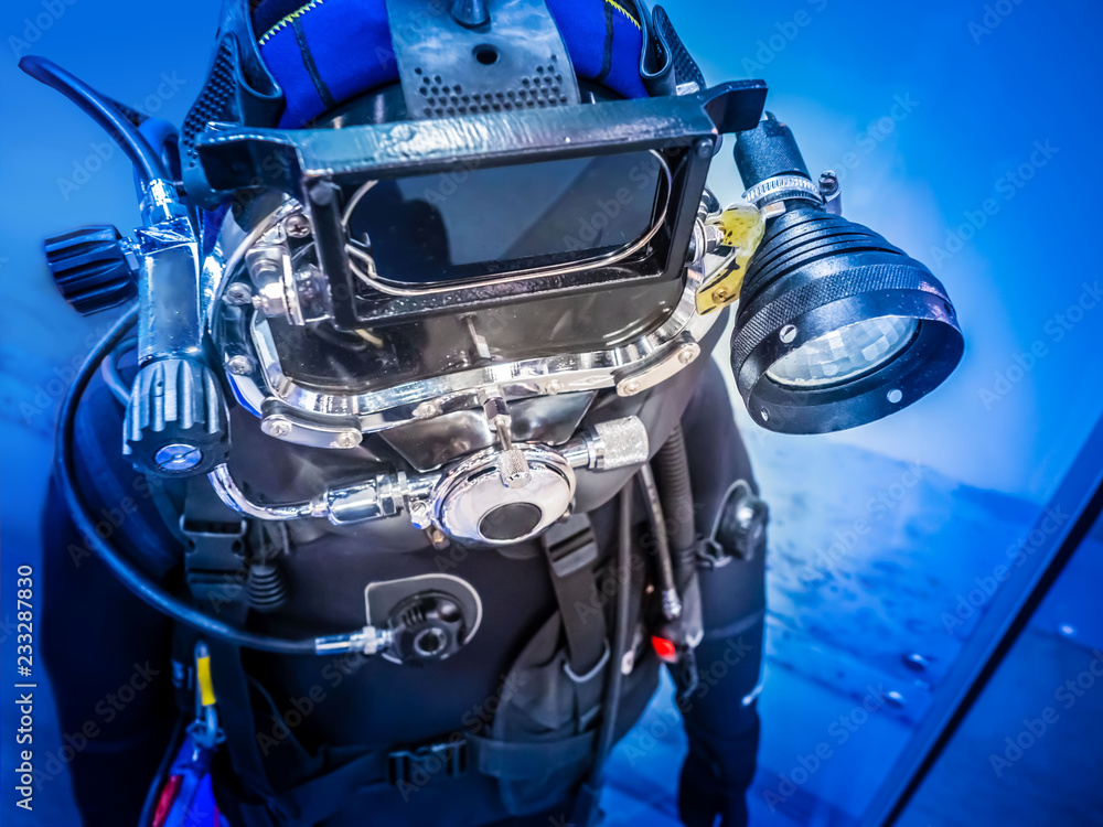 Fototapeta premium Suit submariner. Industrial diving. Deep-sea immersion. Mask submariner with a lantern.