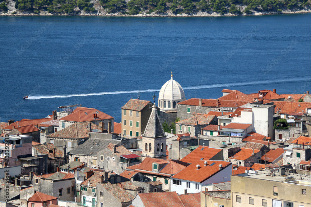 Obraz premium Historic city centre of Sibenik, Croatia with the dome of the Cathedral of St. James, famous UNESCO World Heritage Site. Adriatic Sea in the background. View from the Barone Fortress. 