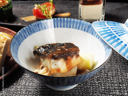 Sea bass fillet with asparagus and sauce in the bowl 