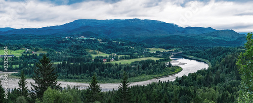 Scenic evening view of Kvisloyra Island. It is located on the Namsen River in Grong municipality, Trondelag county, Norway. Norwegian landscape in summer scenery