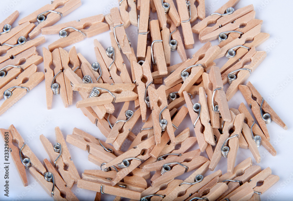 wooden clothespin on the white background