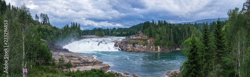 Laksforsen Waterfall is one of most popular tourist attractions in Nordland County, Norway. photo