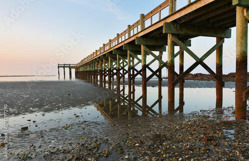 Wallpaper Mural Overview of beautiful fishing pier at sunrise at low tide at Walnut Beach, Milford Connecticut, USA. Torontodigital.ca